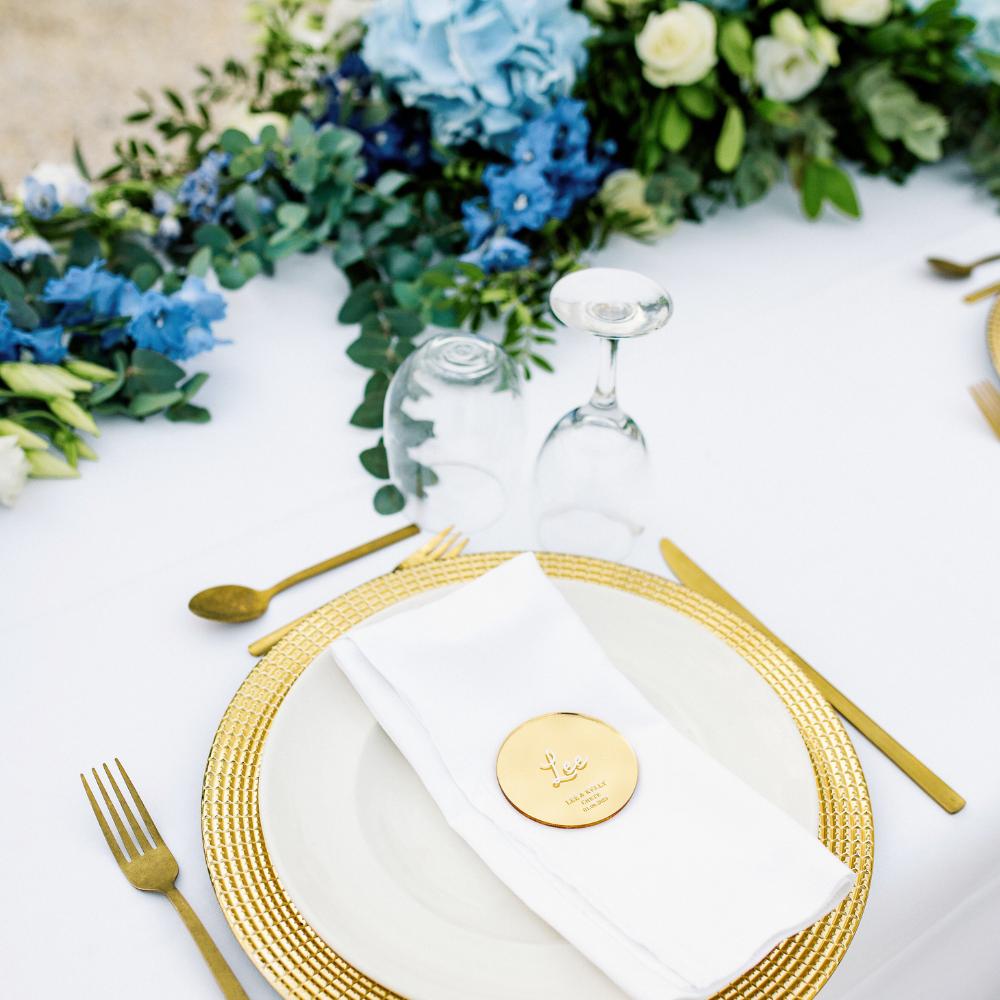 Gold charger and cutlery wedding table setting